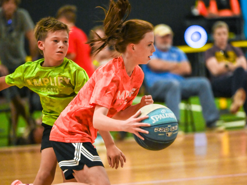 Athletes training in basketball skills and strength sessions at Amplify Sports