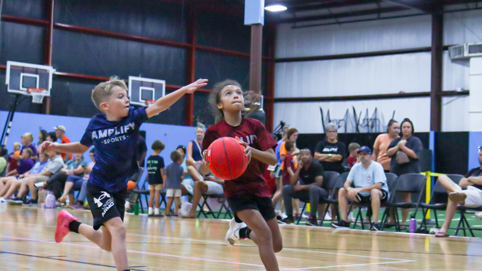 Youth basketball players competing at Amplify Sports in Powdersville SC