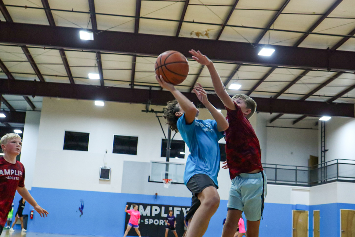 Youth athletes playing in the Amplify Sports 3v3 Basketball League