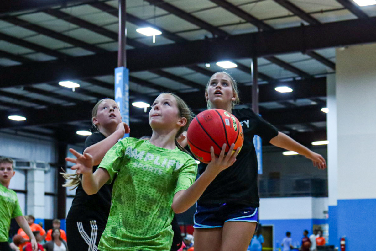 Amplify Sports athlete playing basketball