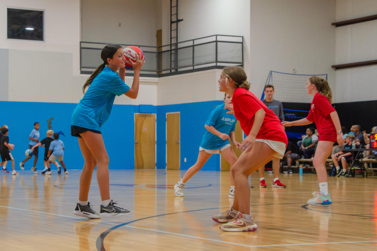 Youth basketball players competing in a 3v3 game